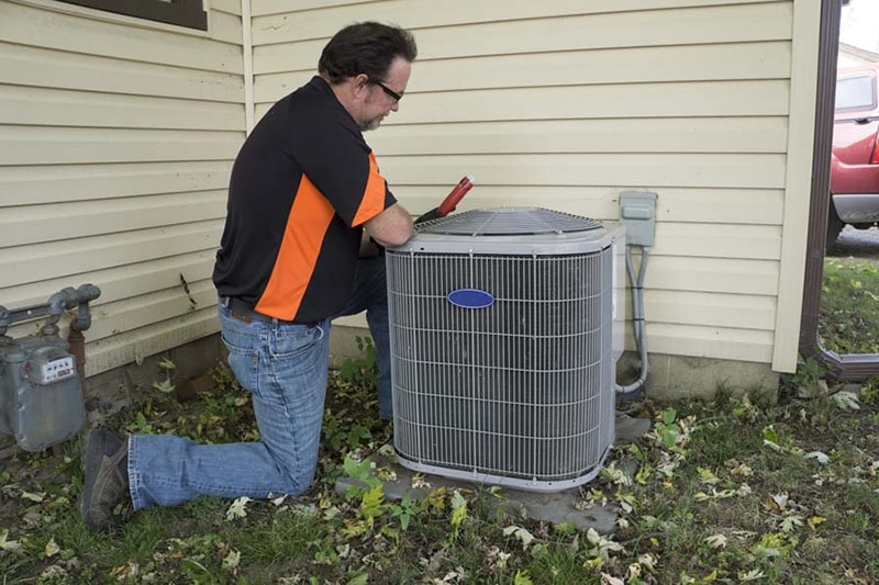 man performing an ac tune-up