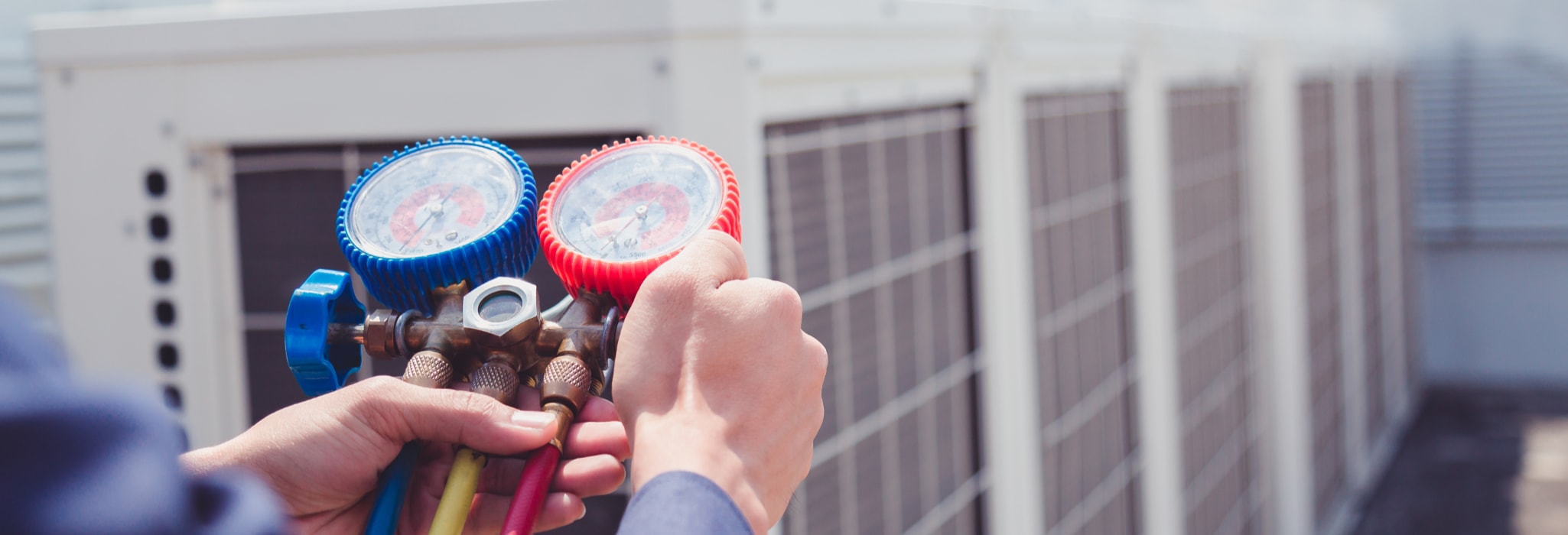 Technician is checking air conditioner ,measuring equipment for filling air conditioners.